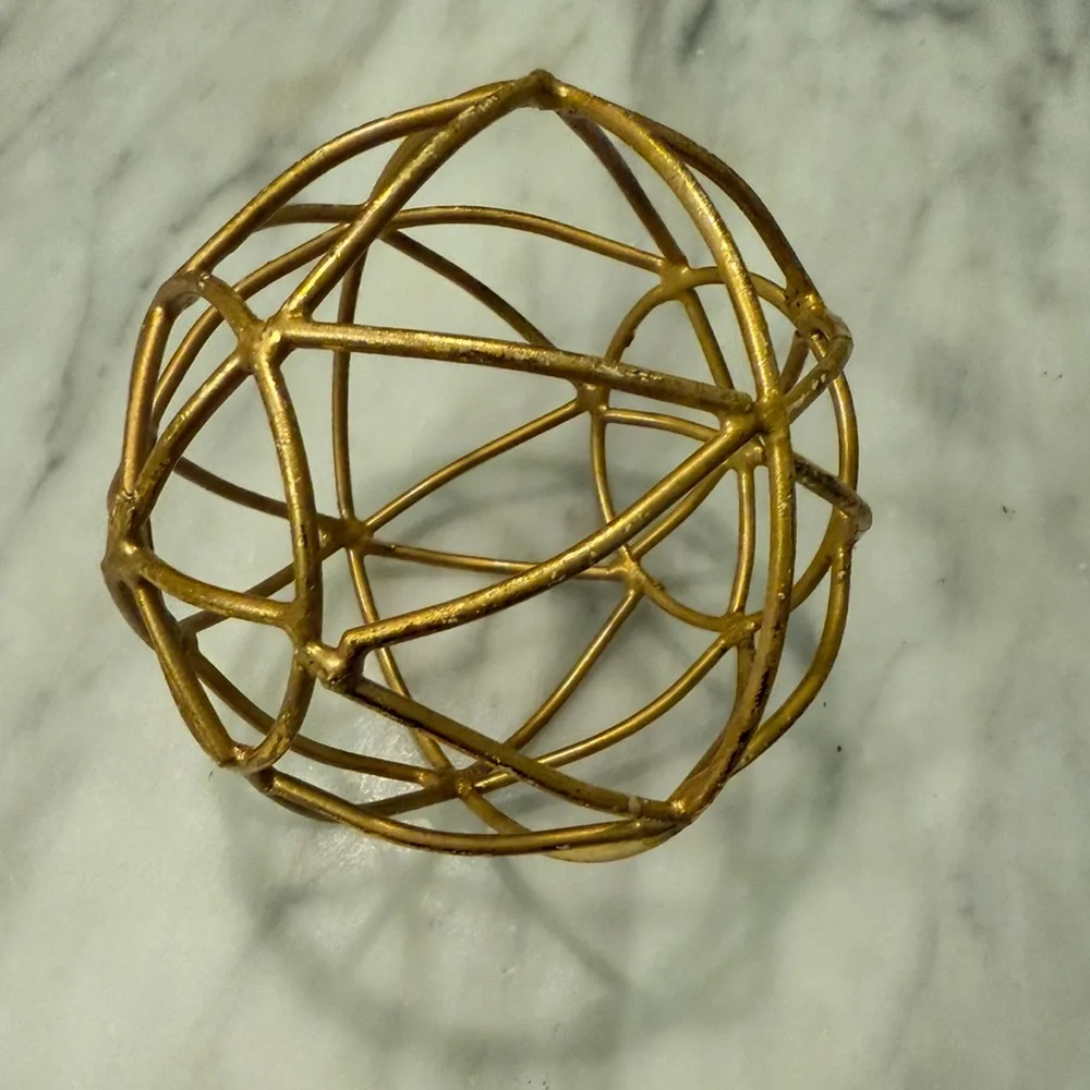 Gold round sculpture
